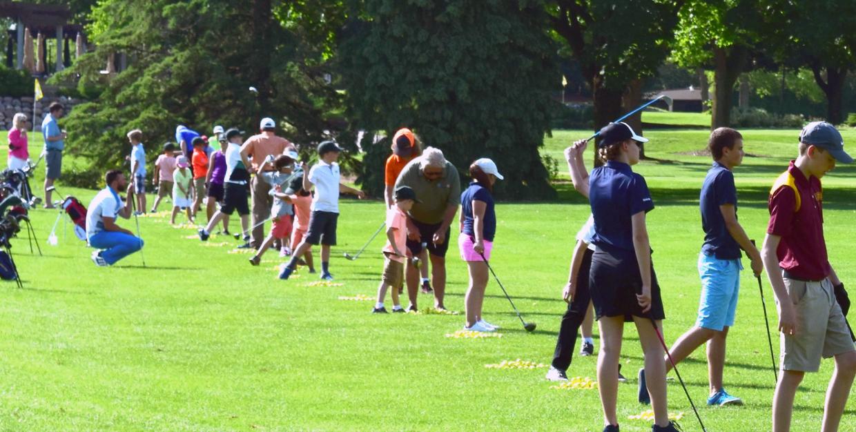 Jr Golf practice on the driving range